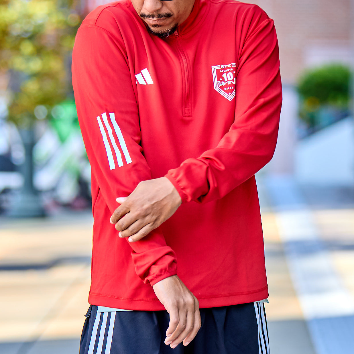 Men's Half Zip - 10M Badge