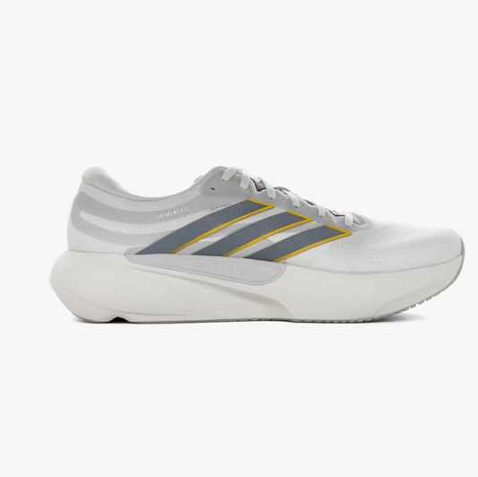 A white Adidas running shoe with gray and yellow stripes, shown in a side profile on a light gray background.