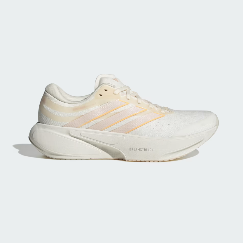 A single Adidas running shoe in off-white and cream with subtle peach-orange stripes, shown in a side profile on a light gray background.