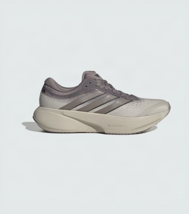 A single Adidas running shoe in a light gray and beige colorway, shown from a side profile against a light gray background.