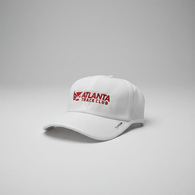 White cap with Atlanta Track Club logo.