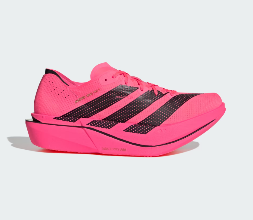 A bright red-pink Adidas running shoe with black three-stripes and a black dotted pattern on the side, shown in a side profile against a light gray background.